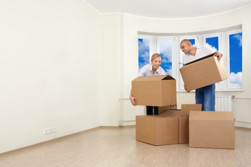 Professional movers handling furniture in a flat move