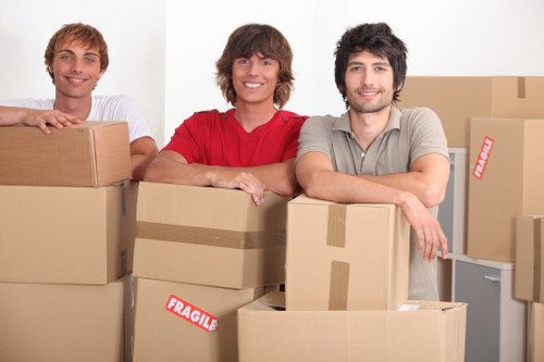 Professional movers loading furniture for a Kingston upon Thames house move