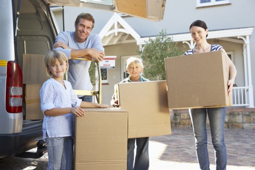Packed moving boxes ready for transport in a Kingston home