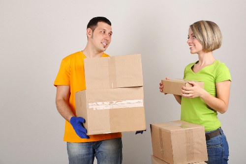 Packed boxes and furniture ready for transport in a Kingston home